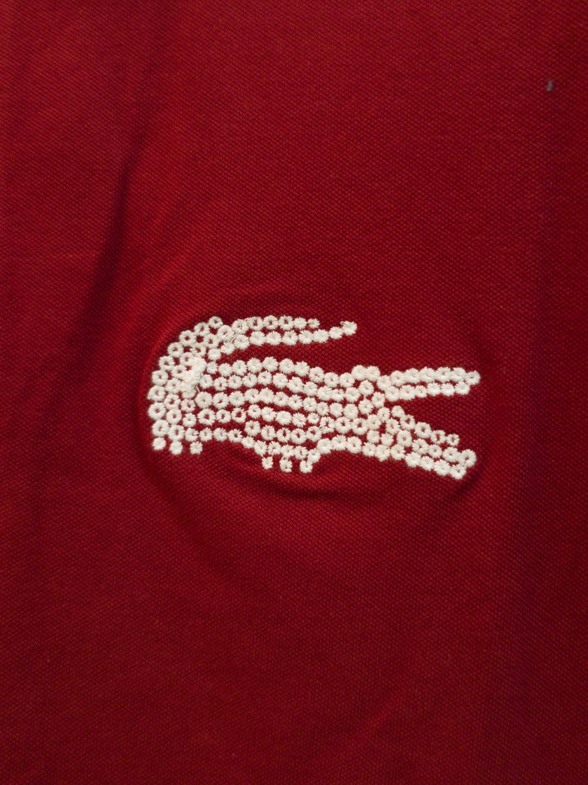 "Lacoste sporty fit red polo T-shirt, lightweight and breathable." "Lacoste red polo T-shirt with the iconic green crocodile logo on the chest." 